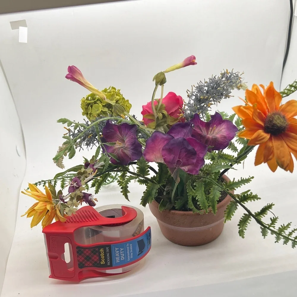 Vibrant Floral Arrangement in Terracotta Pot